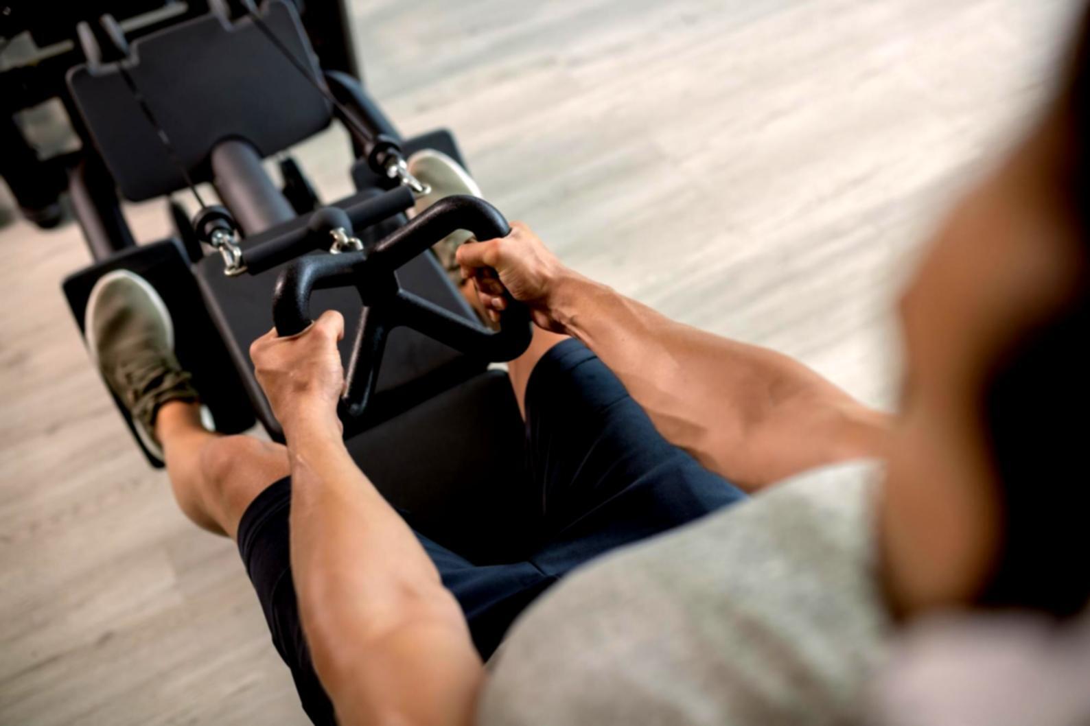 Training session showing instructor working with client on movement technique